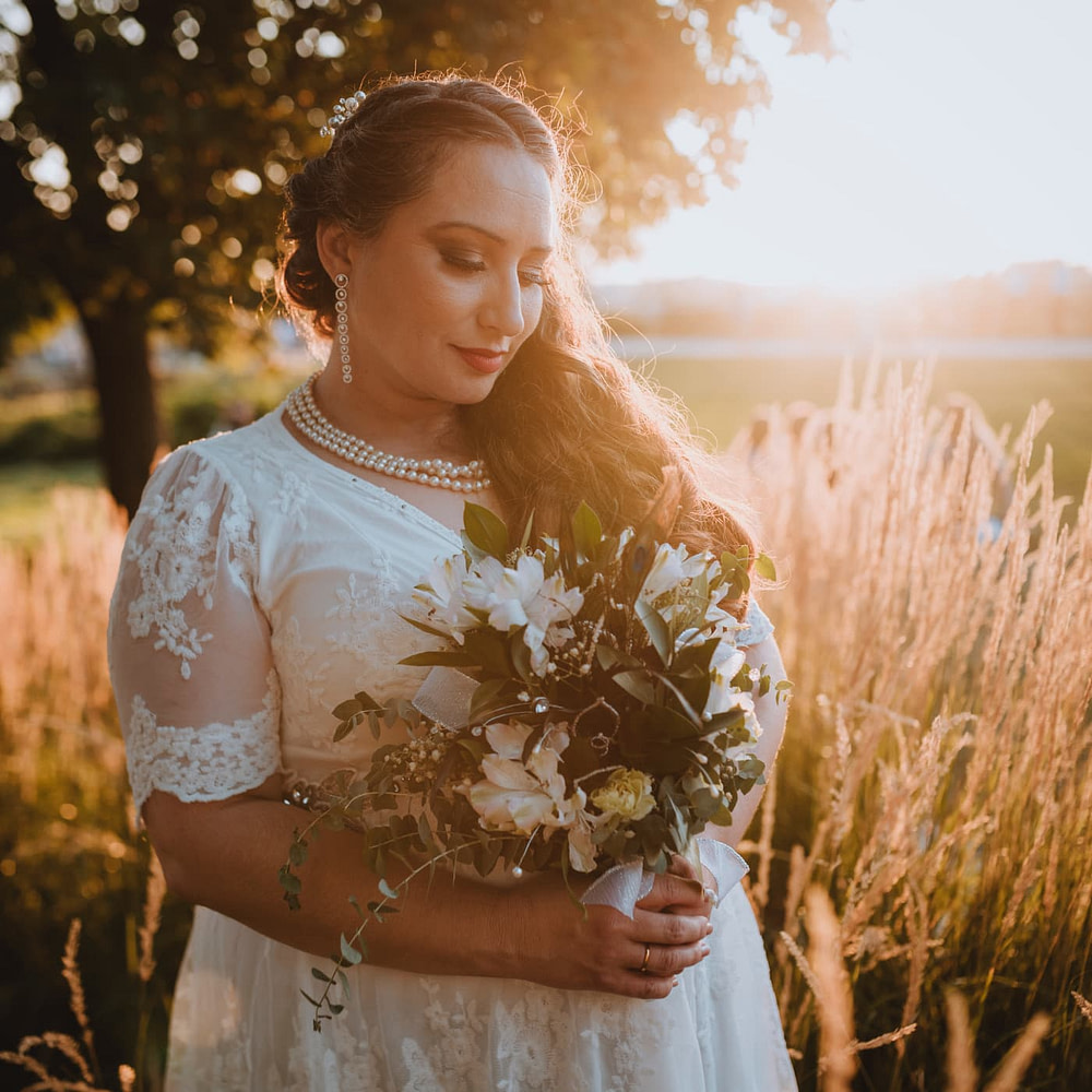 Bride with Bridal Makeup on in a field