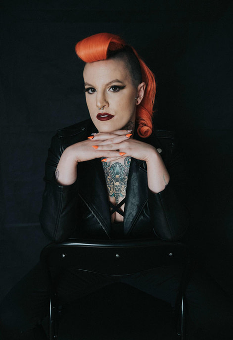 Photo of Gen Waring Ottawa Makeup Artist sitting on a chair