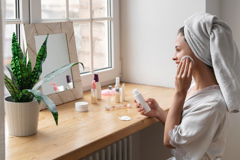 Woman performing a bridal skincare routine in the morning